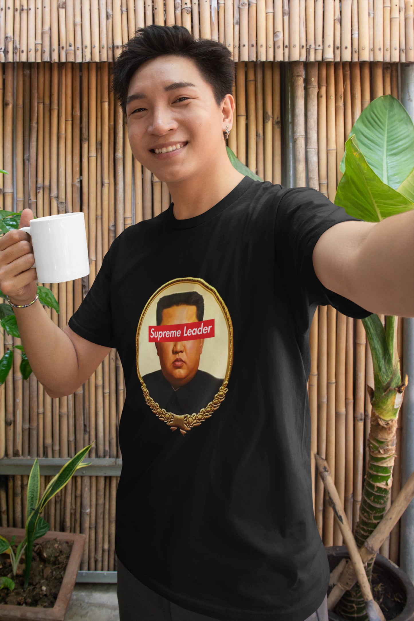 Step into the world of satirical fashion with the Supreme Leader t-shirt—a clever fusion of political commentary and iconic streetwear. Featuring a reimagined portrait of the North Korean dictator with the bold Supreme Leader text blocking his eyes, this design plays on the absurdity of authoritarianism while riffing on the famous supreme streetwear logo.