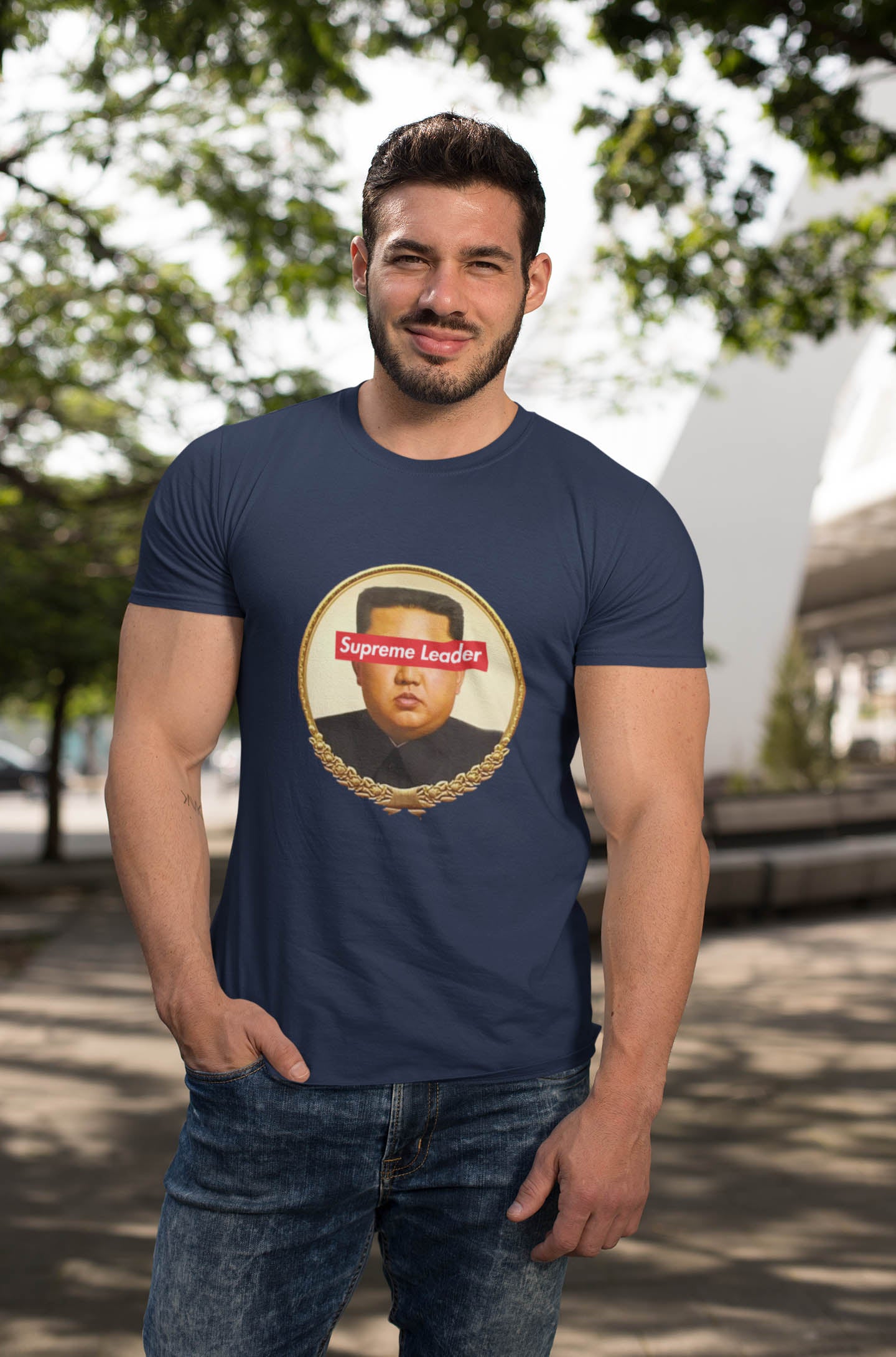 Step into the world of satirical fashion with the Supreme Leader t-shirt—a clever fusion of political commentary and iconic streetwear. Featuring a reimagined portrait of the North Korean dictator with the bold Supreme Leader text blocking his eyes, this design plays on the absurdity of authoritarianism while riffing on the famous supreme streetwear logo.