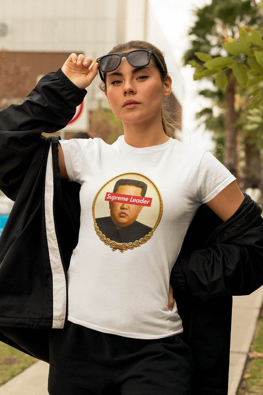 Step into the world of satirical fashion with the Supreme Leader t-shirt—a clever fusion of political commentary and iconic streetwear. Featuring a reimagined portrait of the North Korean dictator with the bold Supreme Leader text blocking his eyes, this design plays on the absurdity of authoritarianism while riffing on the famous supreme streetwear logo.