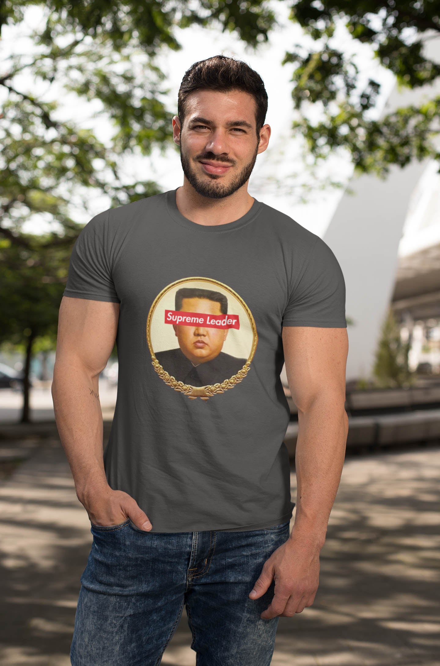 Step into the world of satirical fashion with the Supreme Leader t-shirt—a clever fusion of political commentary and iconic streetwear. Featuring a reimagined portrait of the North Korean dictator with the bold Supreme Leader text blocking his eyes, this design plays on the absurdity of authoritarianism while riffing on the famous supreme streetwear logo.